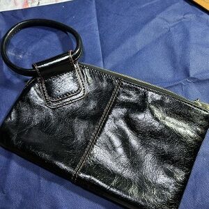 Hobo clutch bag in perfect condition. No call outs. Black beautiful leather.